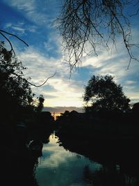 Scenic view of lake against sky at sunset