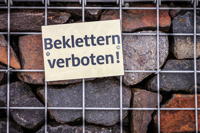 Close-up of text on stone wall