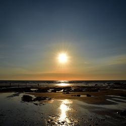 View of beach at sunset