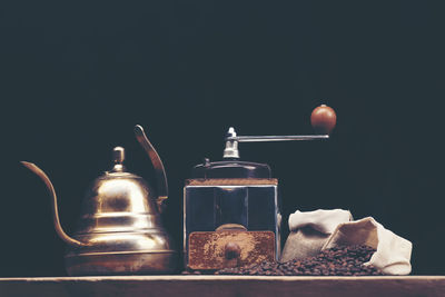 Close-up of cake on table against black background