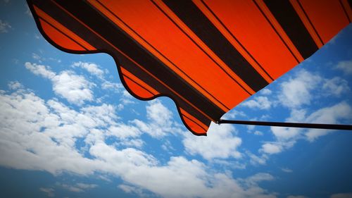 Low angle view of hot air balloon against blue sky