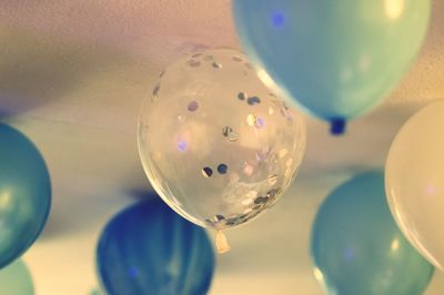 Close-up of balloons on glass