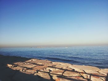 Scenic view of sea against blue sky