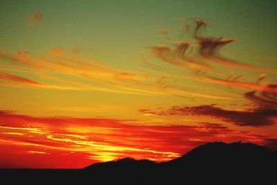 Scenic view of orange sky