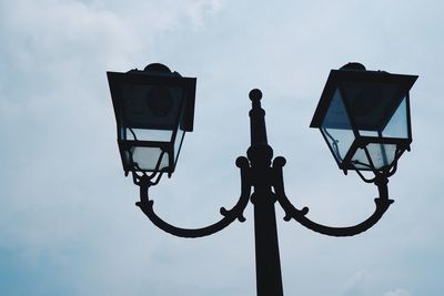 Low angle view of street light against sky