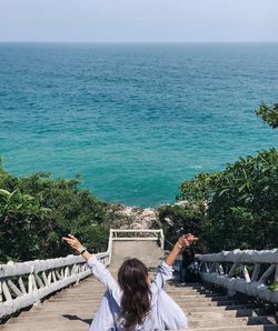 High angle view of woman looking at sea