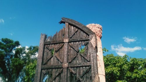 Low angle view of built structure against blue sky