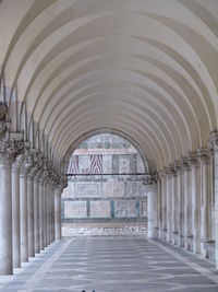 Empty colonnade against wall