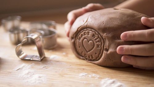 Close-up of hand holding cookie dough