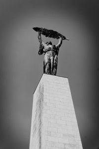 Low angle view of statue against the sky