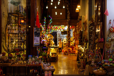 Illuminated lanterns hanging in store