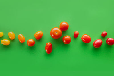 Close-up of tomatoes over white background