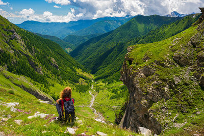 Rear view of woman looking at mountains