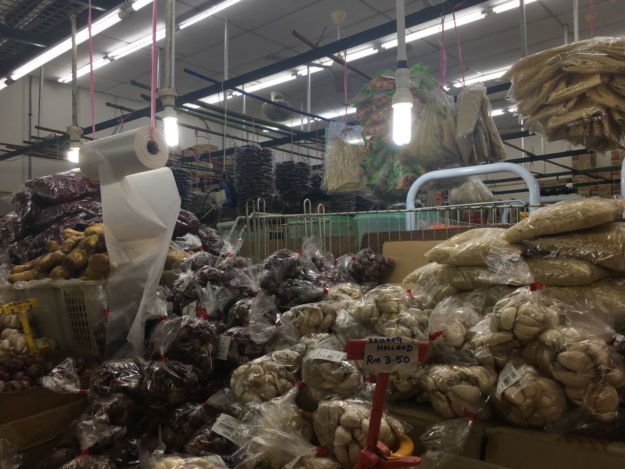 STACK OF FOOD FOR SALE AT MARKET STALL