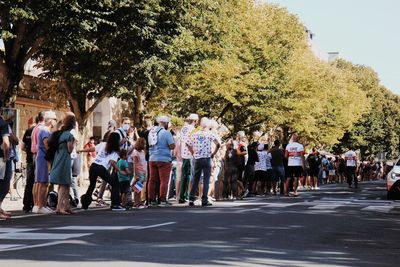 Group of people on road in city