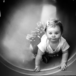 Portrait of cute girl sitting