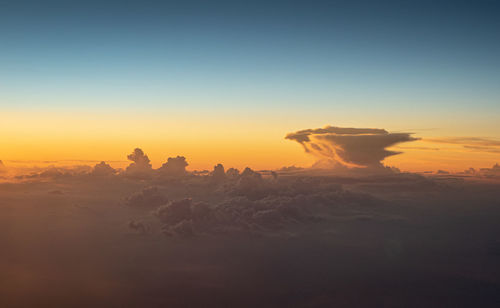 Cirrus and some distant cumulus and cumulonimbus south of saint-tropez at sunset