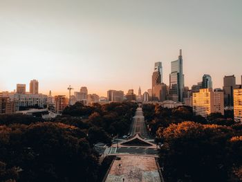 View of city buildings against clear sky