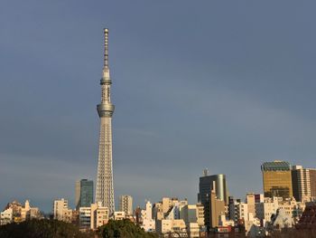 Low angle view of skyscrapers in city against sky