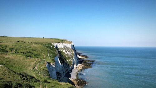 Scenic view of sea against clear blue sky