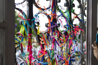 Colored ribbons attached to the iron grid. 