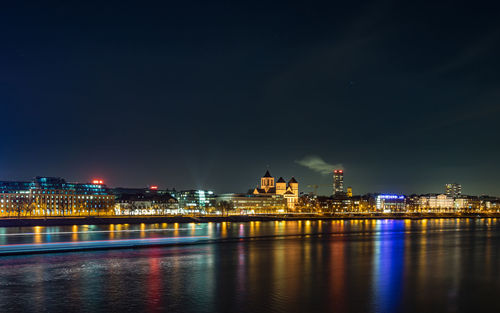 Illuminated buildings in city at night