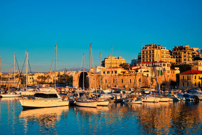 Venetian fort in heraklion and moored fishing boats, crete island, greece