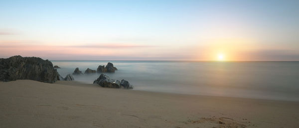 Scenic view of sea against sky during sunset