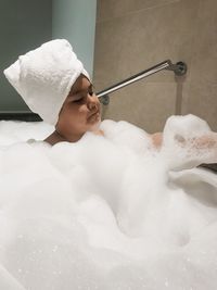 Boy taking bubble bath