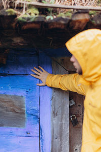 Midsection of woman holding umbrella