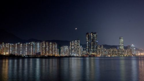 Illuminated city lit up at night