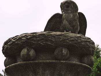 Low angle view of statue against sky