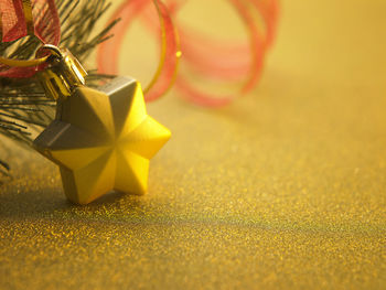 Close-up of christmas ornaments hanging on tree