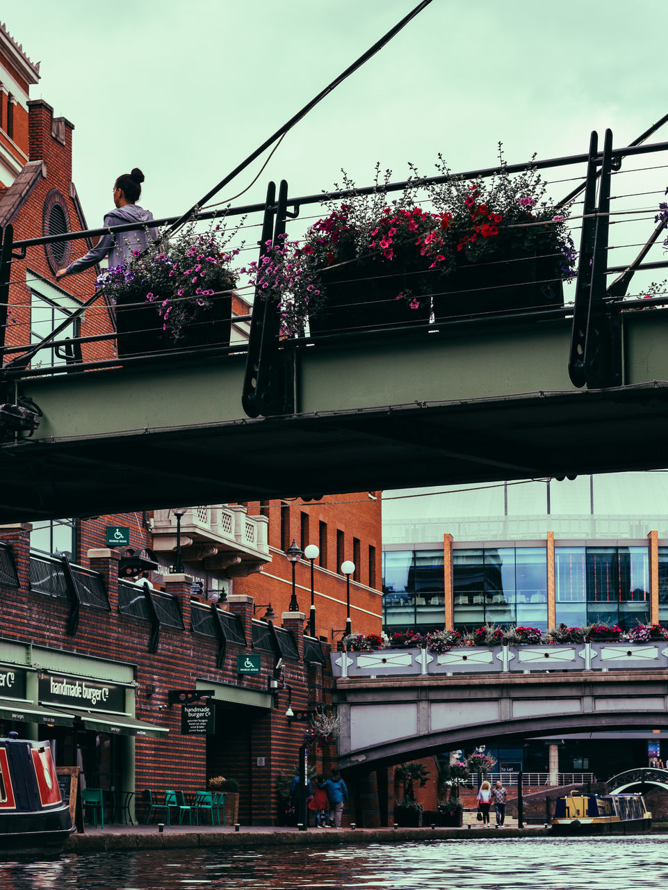 LOW ANGLE VIEW OF BUILDINGS AND BRIDGE AGAINST SKY