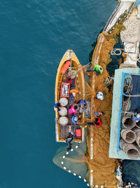 High angle view of people on boat in sea