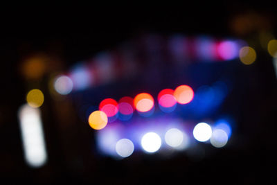 Defocused image of illuminated lights at night