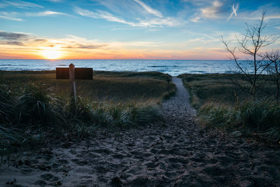 Scenic view of beach against sky during sunset