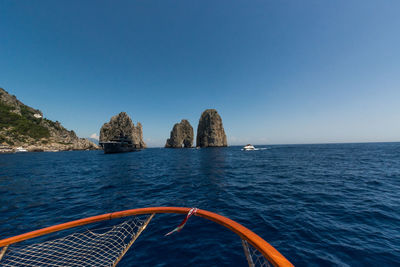 Scenic view of sea against clear blue sky