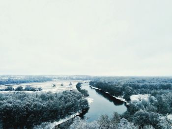 Scenic view of landscape against clear sky during winter