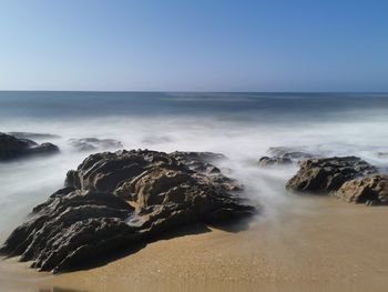 Scenic view of sea against clear sky