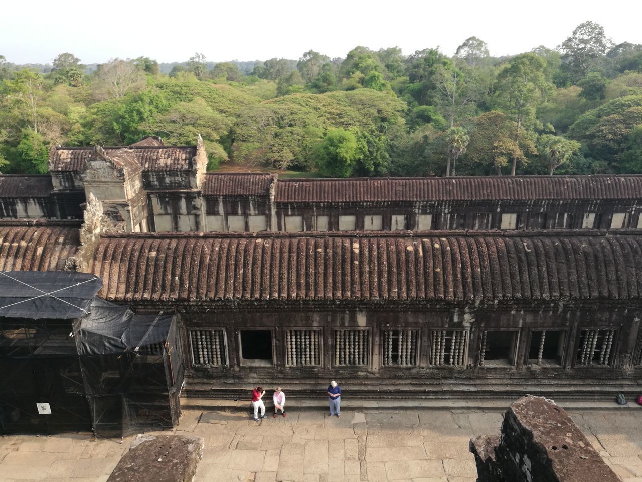 HIGH ANGLE VIEW OF PEOPLE WALKING ON ROOF