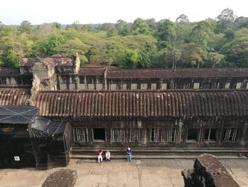 High angle view of people walking on building