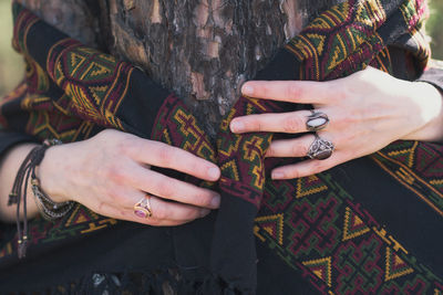 Close up woman hand embracing tree concept photo