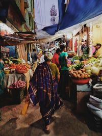 People at market stall
