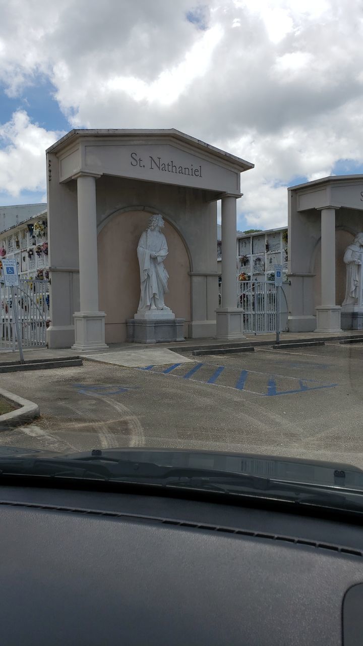 STATUE IN FRONT OF BUILDING