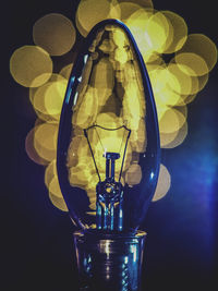 Close-up of illuminated light bulb