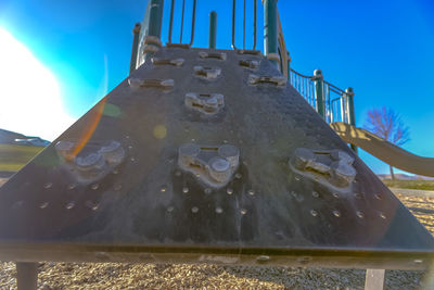 Low angle view of playground against clear sky