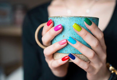 Close-up of woman holding ring