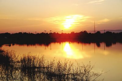 Scenic view of lake against sky during sunset