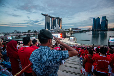 Rear view of people on boat in river